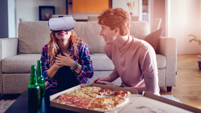 Eating pizza wearing VR headset