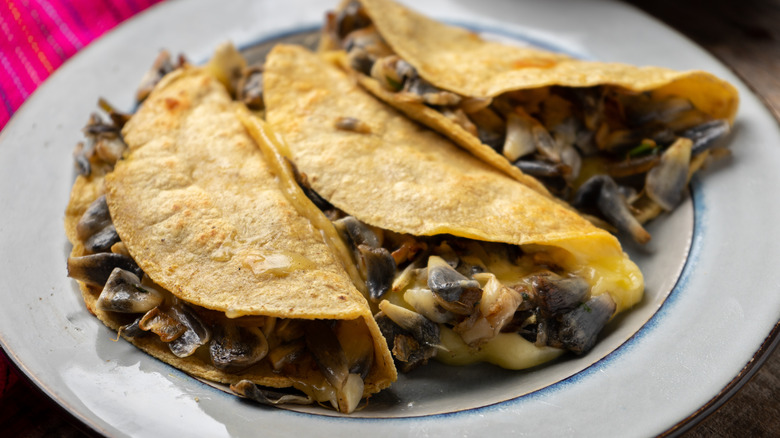 Huitlacoche quesadillas on white plate