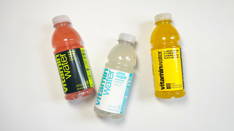 Three bottles of Vitaminwater on a white background