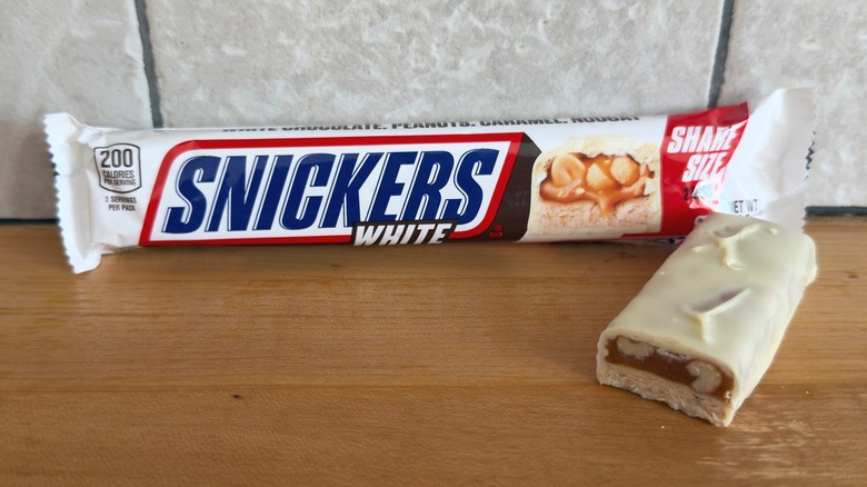 White Snickers bar with piece cut in half