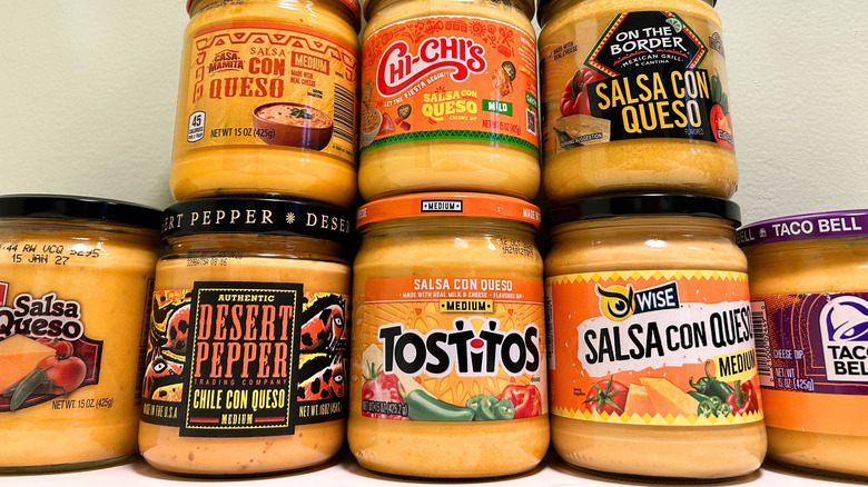 Close up of several queso brands lined up together