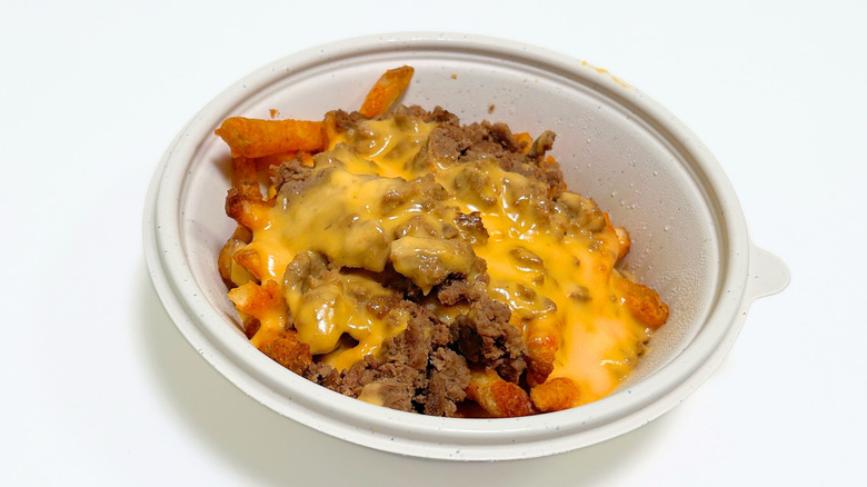 Close up of Wawa Cheesesteak Loaded Fries in a to-go container