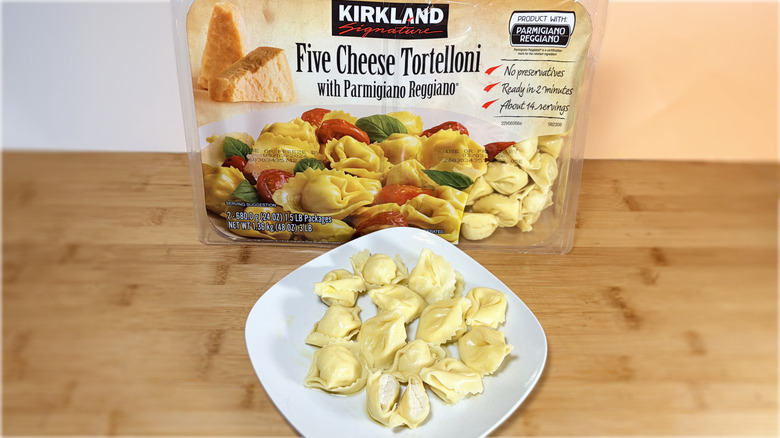 package and plate of tortelloni on table