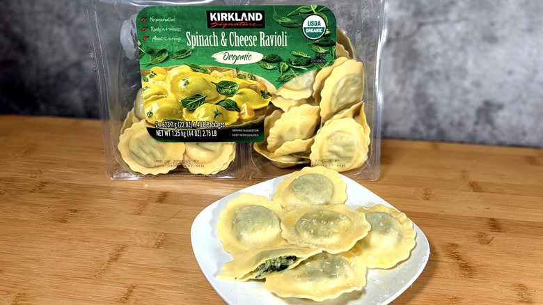 package and plate of spinach ravioli on table