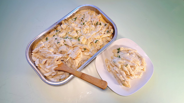 pan and plate of chicken alfredo penne bake
