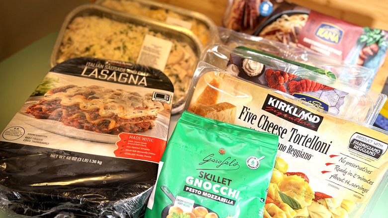 various packages of pasta from costco displayed on table