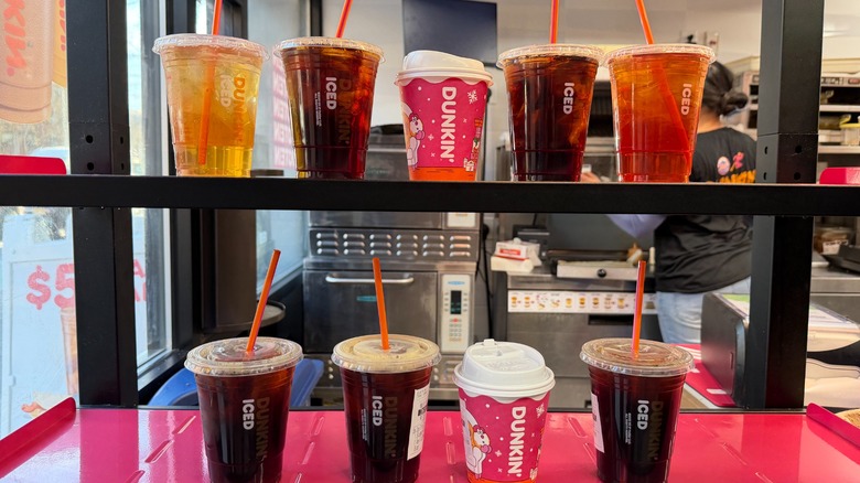 9 Dunkin' drinks lined up on an order window