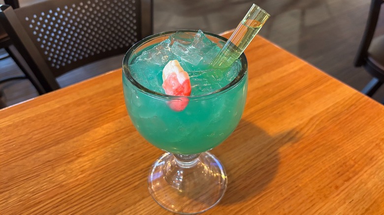 Applebee's Sleigh All Day Rita with vibe shot and Santa gummy on wooden table