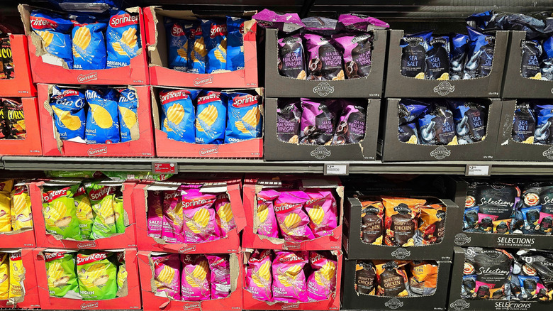 boxes of Aldi private label potato chips on a store shelf