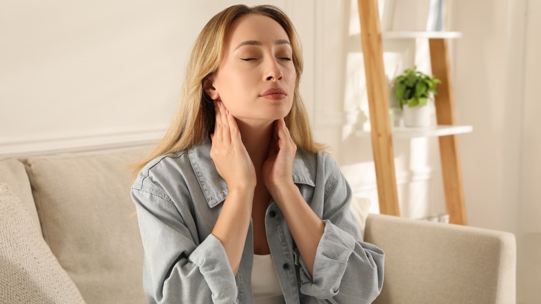Woman feeling lymph nodes