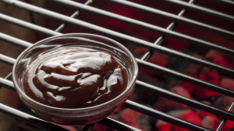 bbq sauce ramekin on grill
