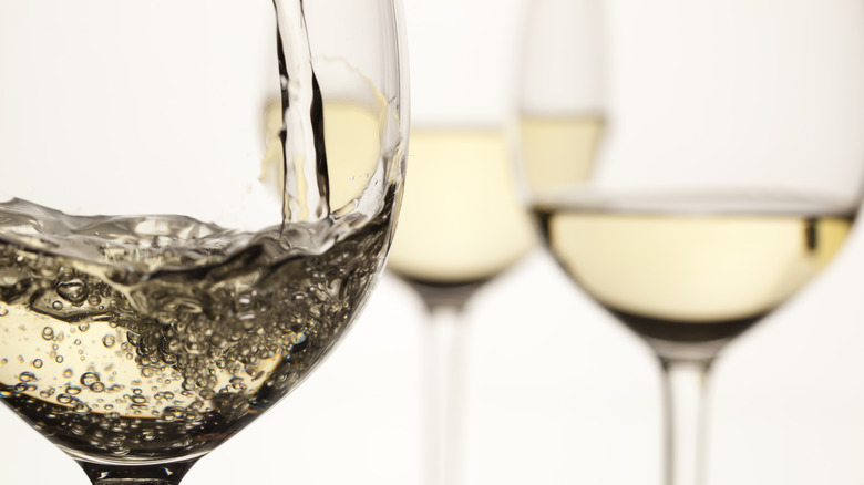 three glasses of white wine