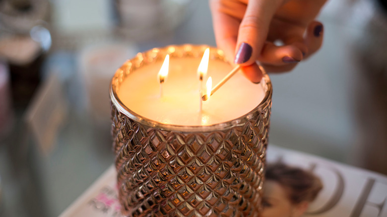 Lighting a large candle