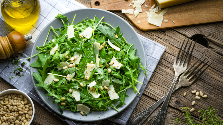 Green salad with pine nuts and Parmesan
