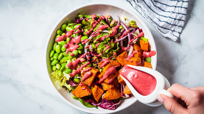 Cranberry and Dijon salad dressing on salad