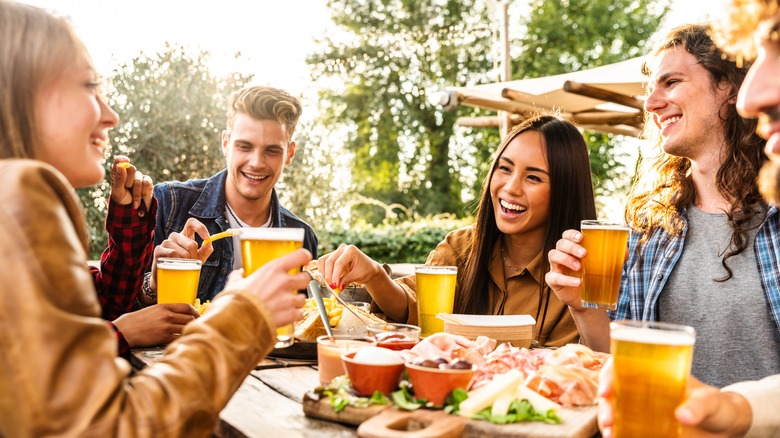A group of people enjoying beer