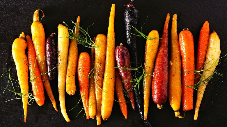roasted carrots on black backdrop