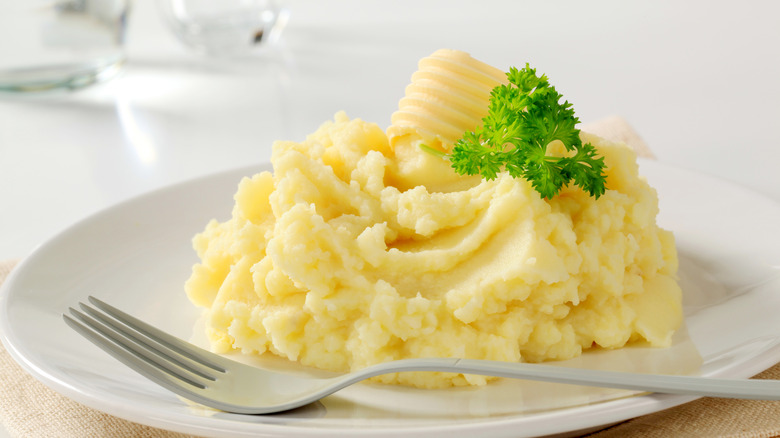 mashed potatoes on plate with fork