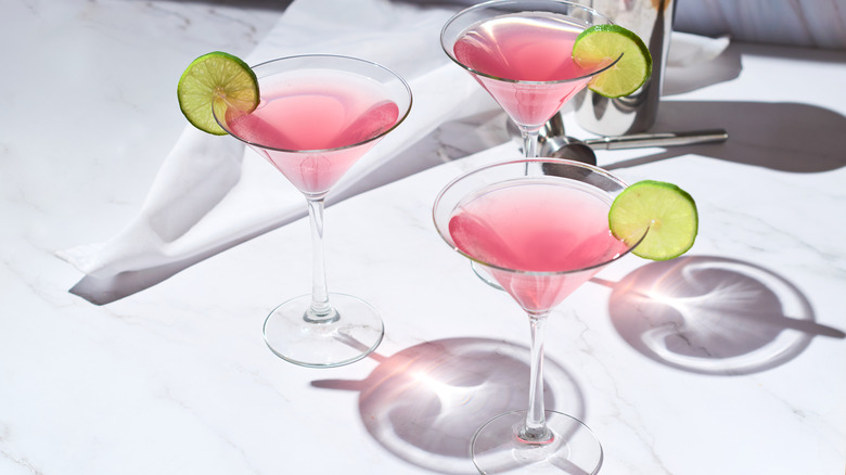 Three cosmopolitans with lime wheels