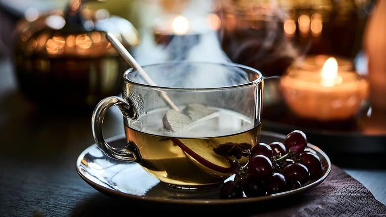 IKEA Light brown glass Höstagille mug with cider sitting on a table