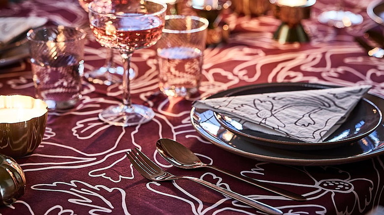 Red/white floral pattern Höstagille tablecloth from IKEA on a dining table