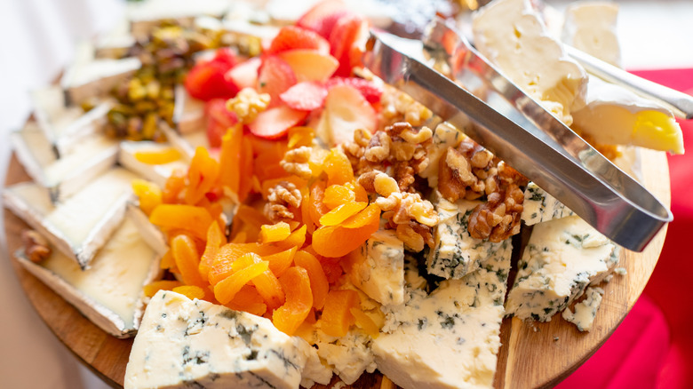 Cheeses and fruits on a plate