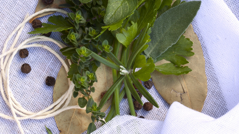 Herbs, twine, and cheesecloth