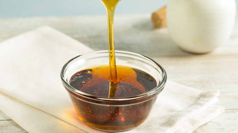 agave syrup being poured into a small boul