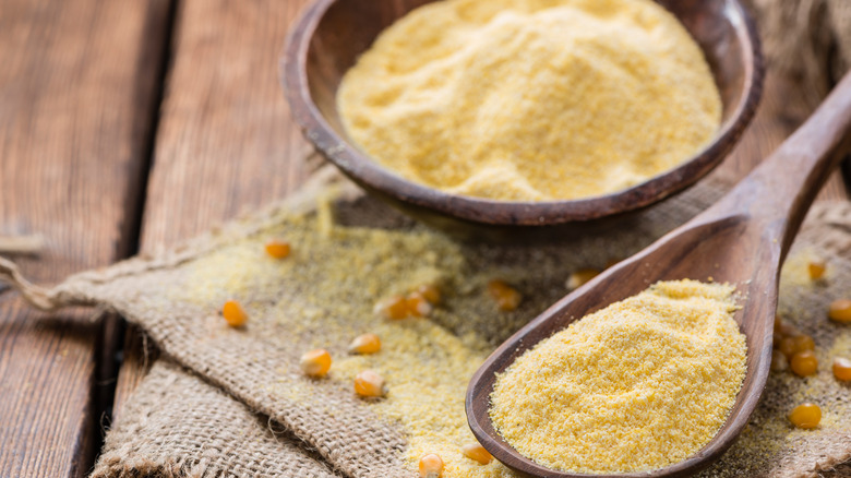 cornmeal in a rustic spoon and bowl set