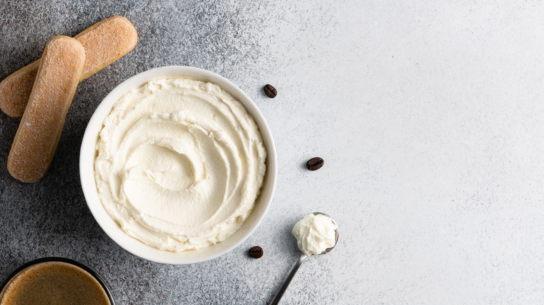 whipped cream cheese in a bowl with cookies on side