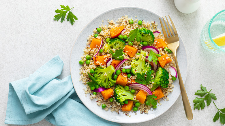 Broccoli salad with pumpkin and fork