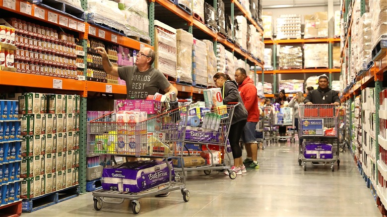Costco shoppers in warehouse aisle