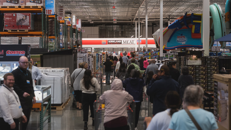 customers walking toward meat department