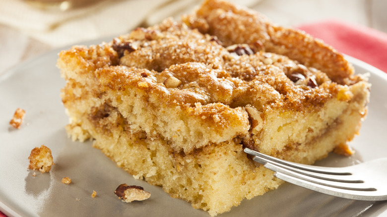 Slice of coffee cake on plate with fork