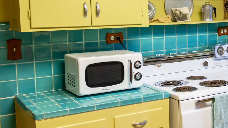 Retro yellow and teal kitchen with microwave