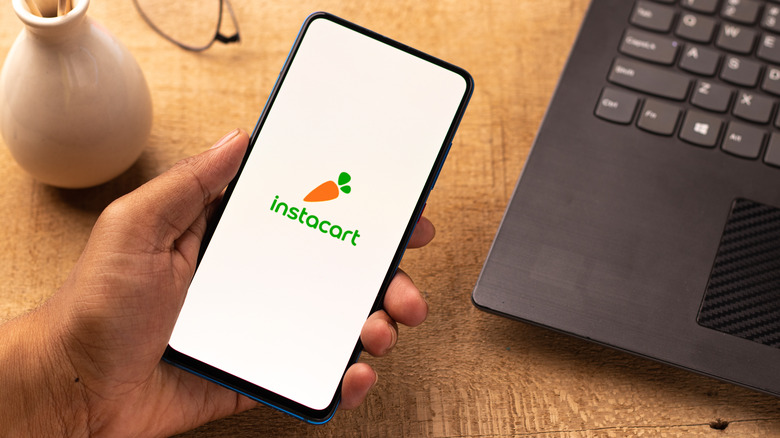 hand holding phone with instacart app open