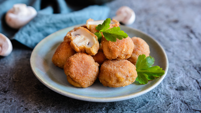 A plate with deep-fried mushrooms