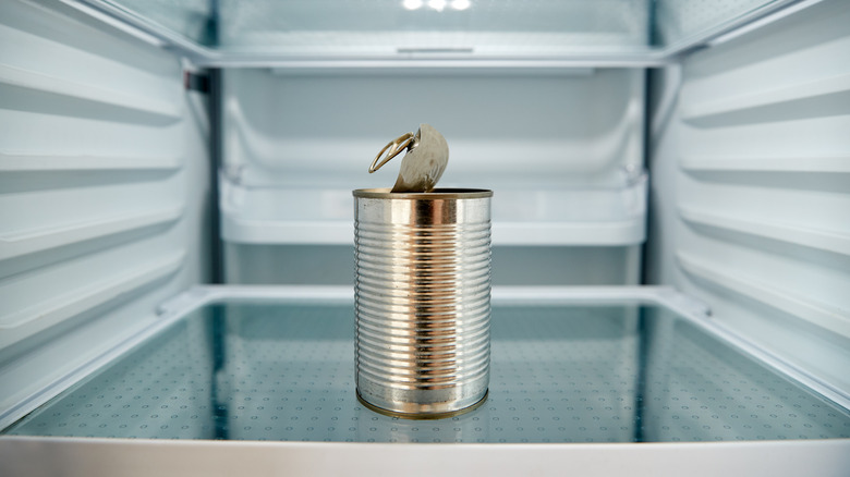 open can of food in refrigerator
