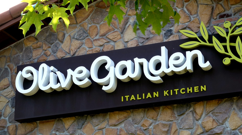 Olive Garden sign on stone wall