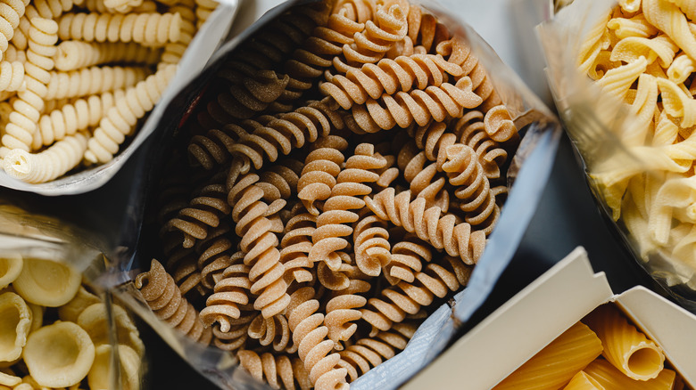 Different dried pastas separated by containers