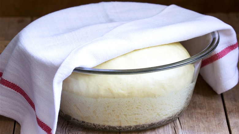 towel covering bread dough bowl