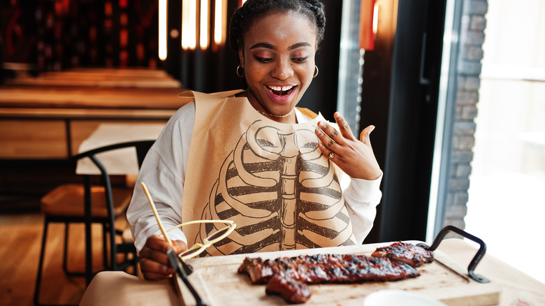 Woman eating smoked meat