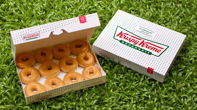 Krispy Kreme boxes in grass