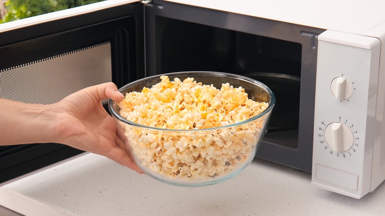 Bowl of popcorn and microwave