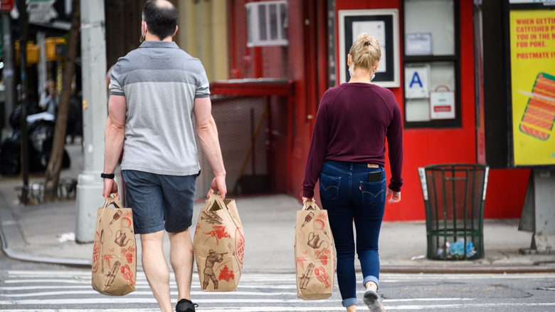 shoppers with Trader Joe's bags