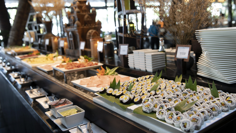 buffet table with sushi and other offerings
