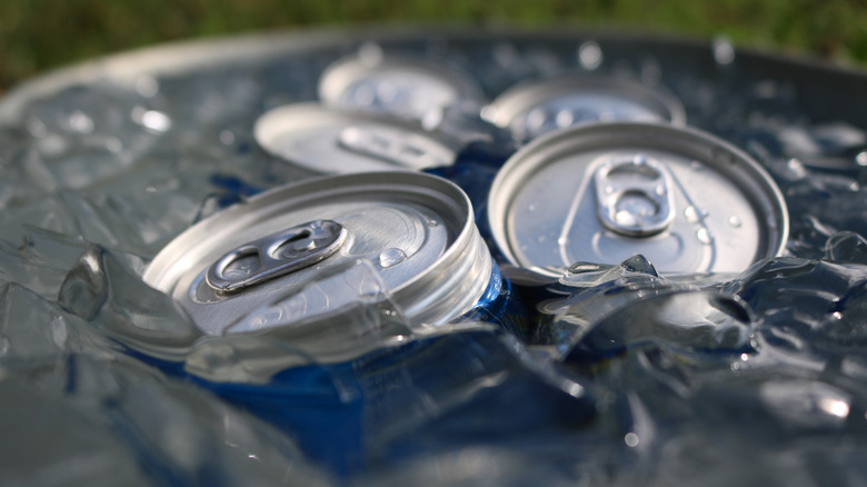 Cans of beer in an icy, salty, water bath