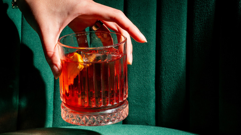 Negroni cocktail with a green background