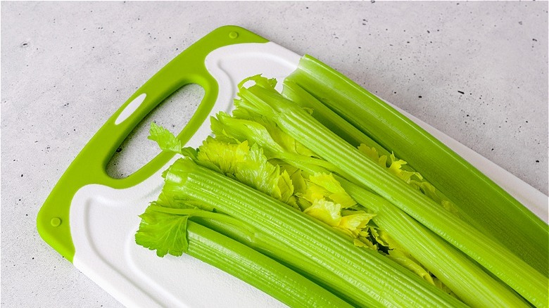 Celery ribs on cutting board 
