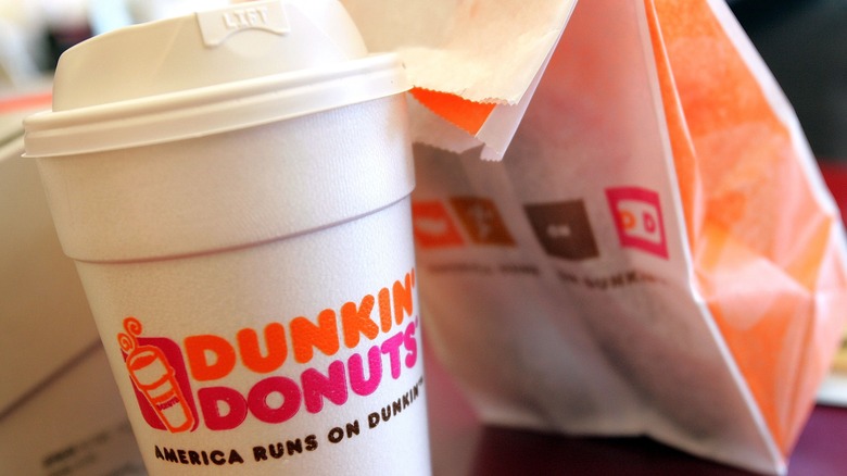 Dunkin' Donuts coffee with a paper bag
